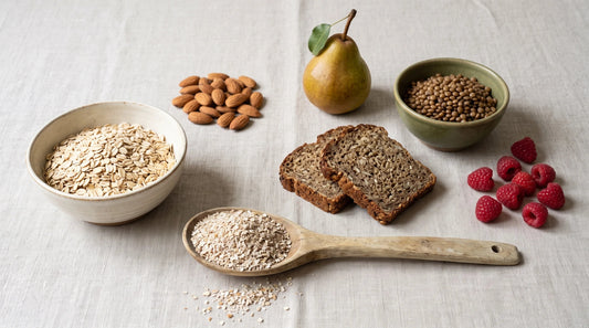 A day of high-fibre foods laid out: oats, almonds, wholegrain bread, pear, lentils, raspberries and a tablespoon of rye bran