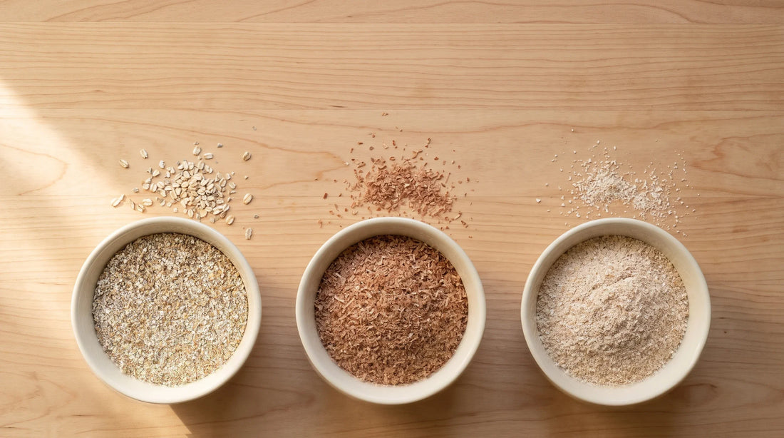 Rye bran, wheat bran and oat bran side by side in three bowls, showing their different colour and texture